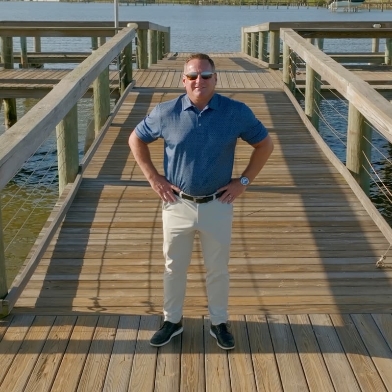 Man standing on pier deck