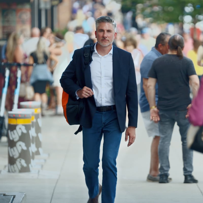 Man walking down city street